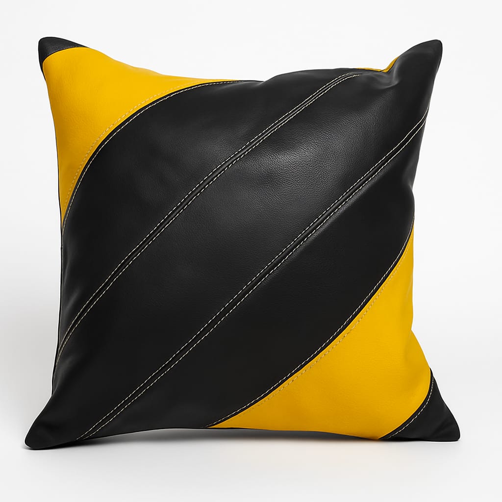 Black and yellow pillow with a diagonal leather pattern on a white background